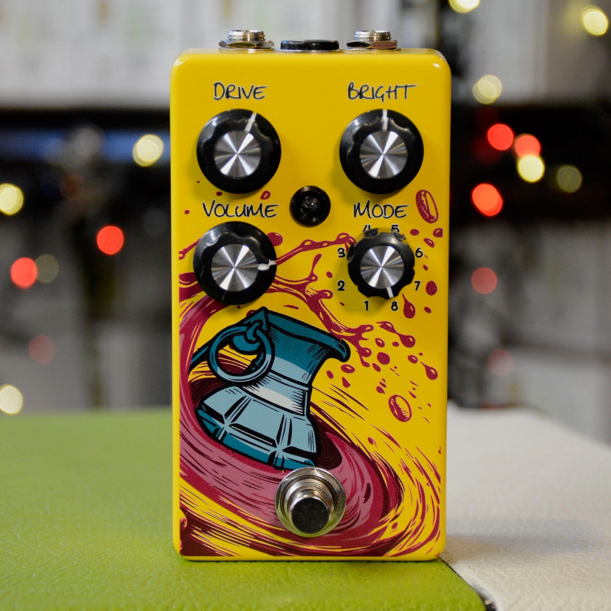 GUPTech FrAG Boost controls showing 8-mode toggle and level knob handmade in Quebec, yellow, face