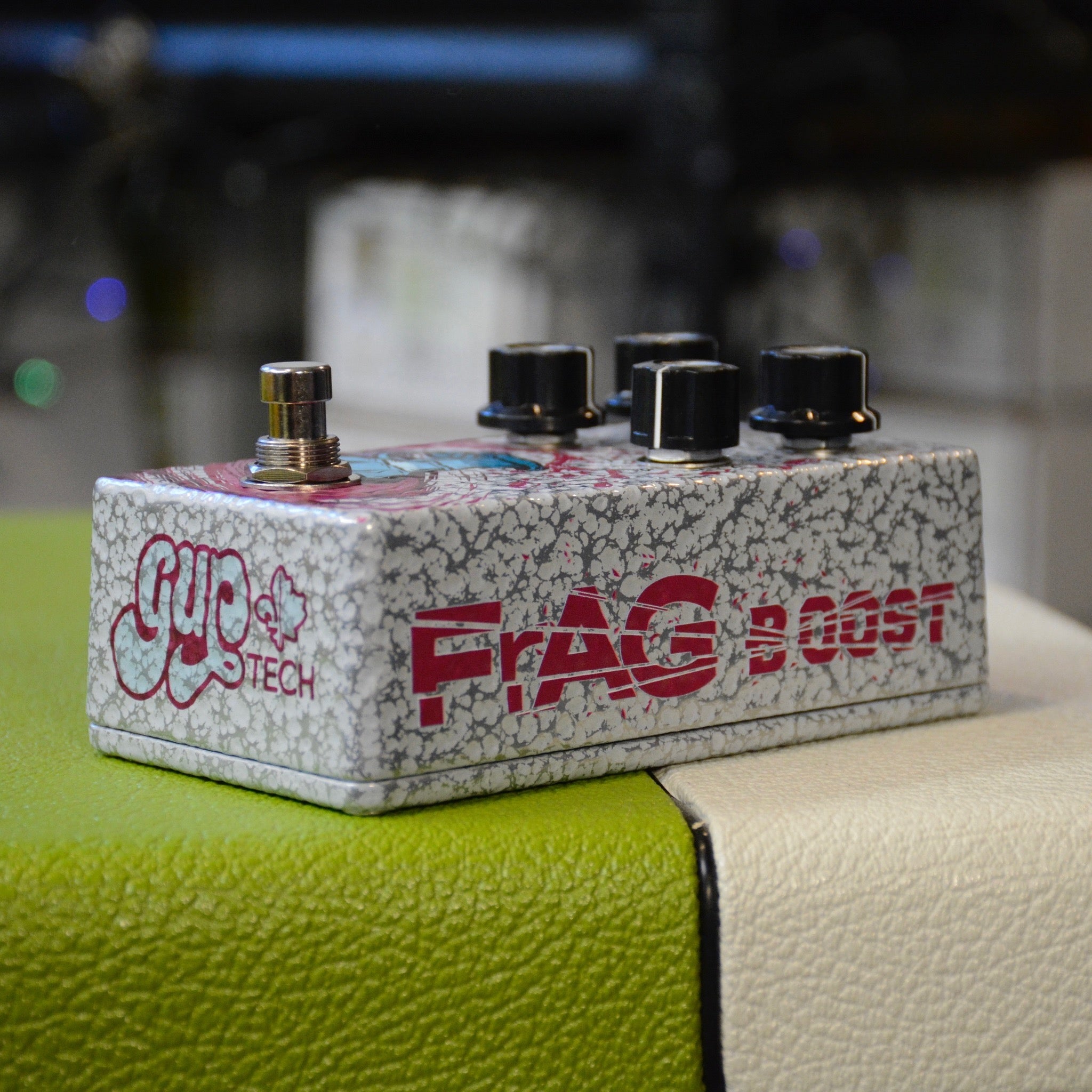 GUPTech FrAG Boost controls showing 8-mode toggle and level knob handmade in Quebec, hammered grey name and logo side