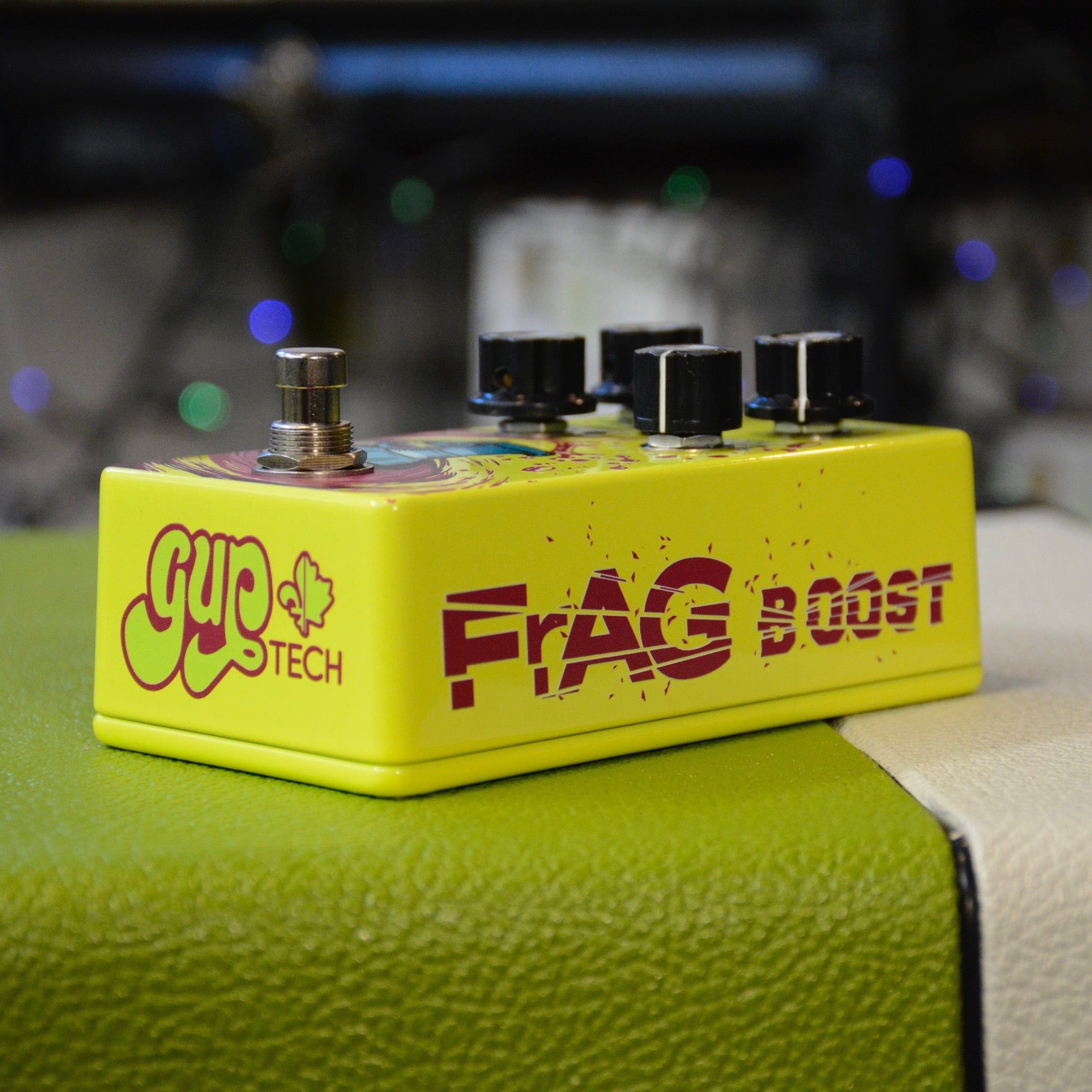GUPTech FrAG Boost controls showing 8-mode toggle and level knob  handmade in Quebec, neon yellow, logo and name
