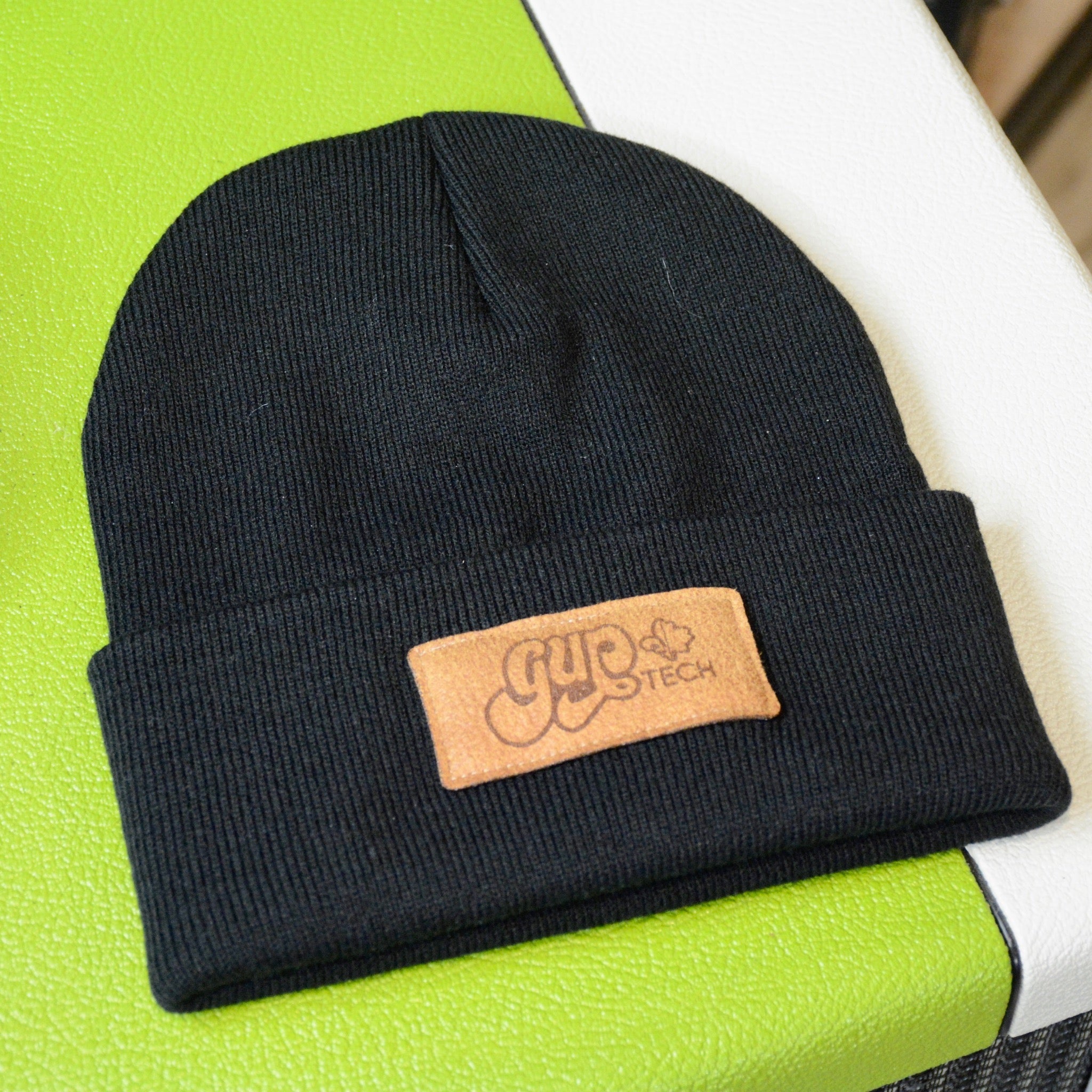GUPTech logo on a tan patch, black knit toque